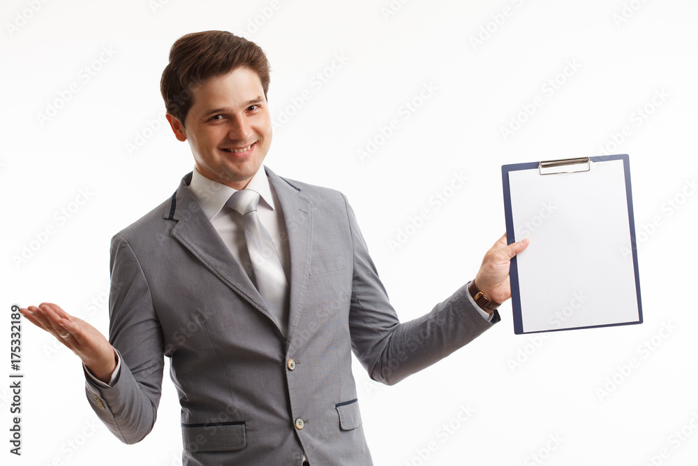 Young businessman showing blank clipboard, isolated on white background. Success in business, job and education concept shot Young businessman showing blank clipboard, isolated on white background. Success in business, job and education concept shot