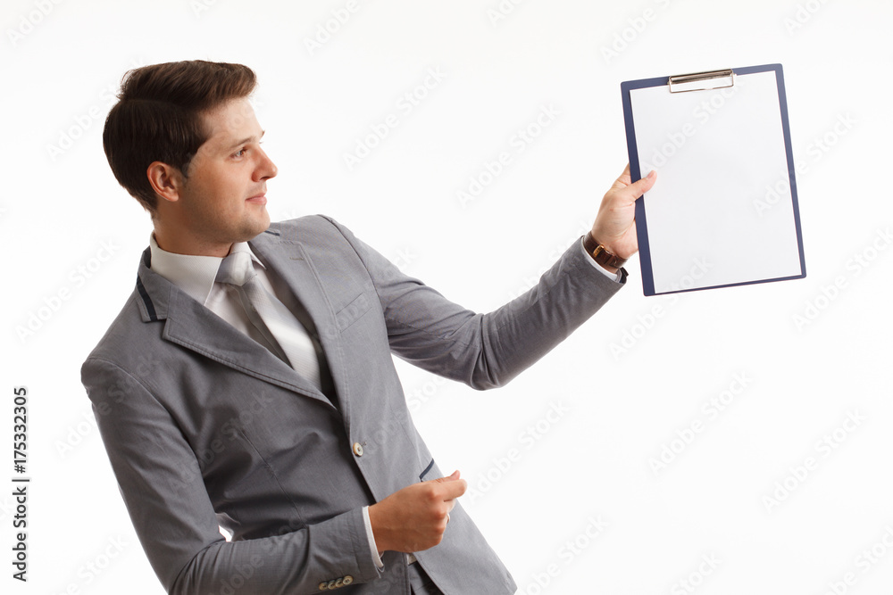 Young businessman showing blank clipboard, isolated on white background. Success in business, job and education concept shot Young businessman showing blank clipboard, isolated on white background. Success in business, job and education concept shot