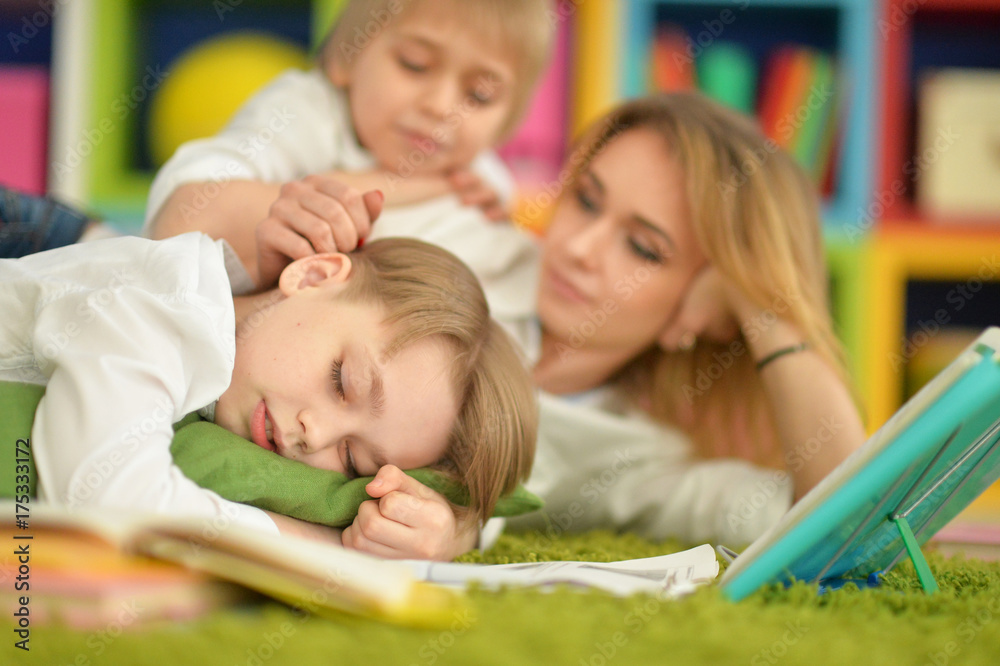 mother and sons doing homework mother and sons doing homework