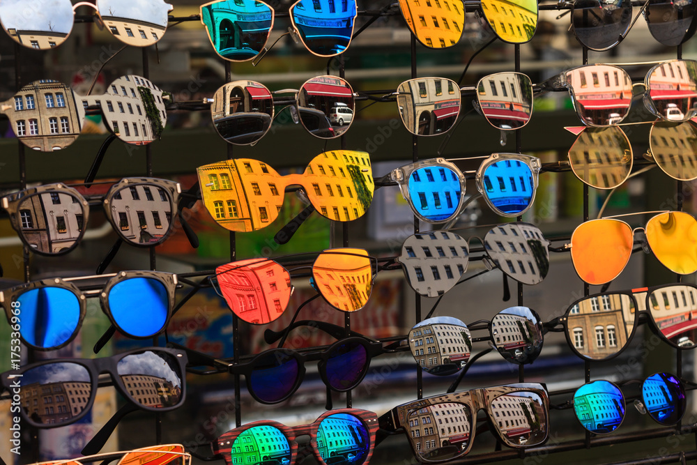 Berlin, Germany, August 15 in 2017 mirrored sunglasses showing reflection of street houses.