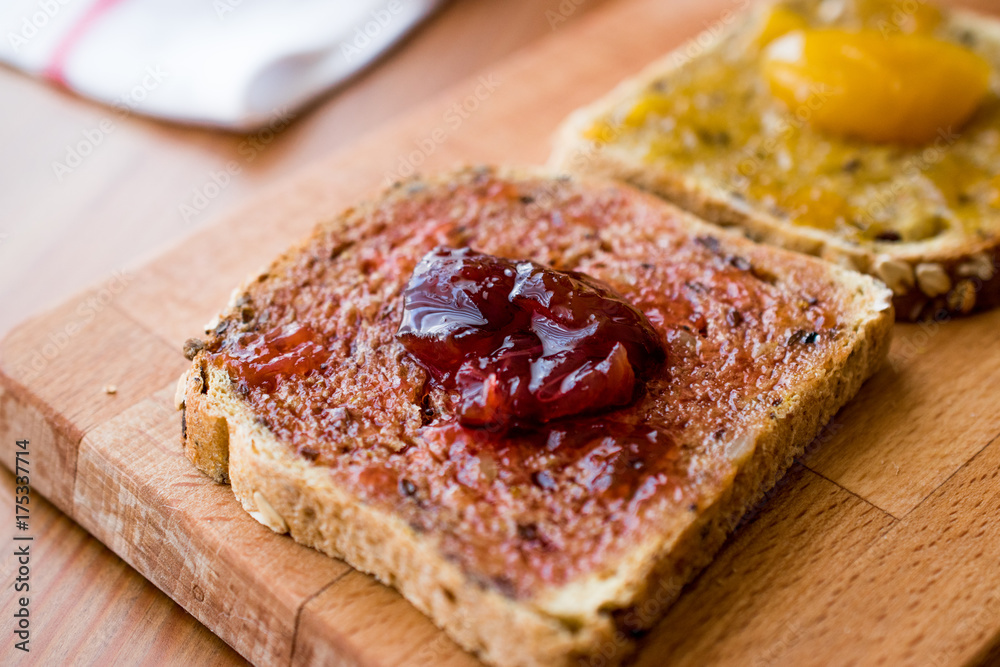 Damson Plum Jam on bread with Apricot jam Damson Plum Jam on bread with Apricot jam