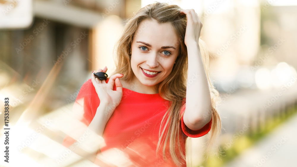Portrait of smiling woman in red jacket