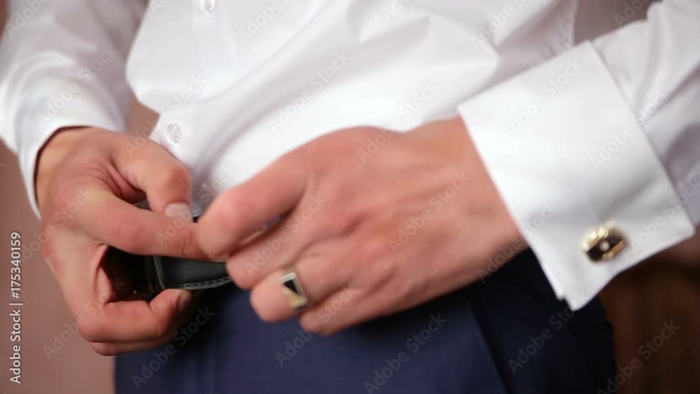 Man wear belt in the room Man wear belt in the room