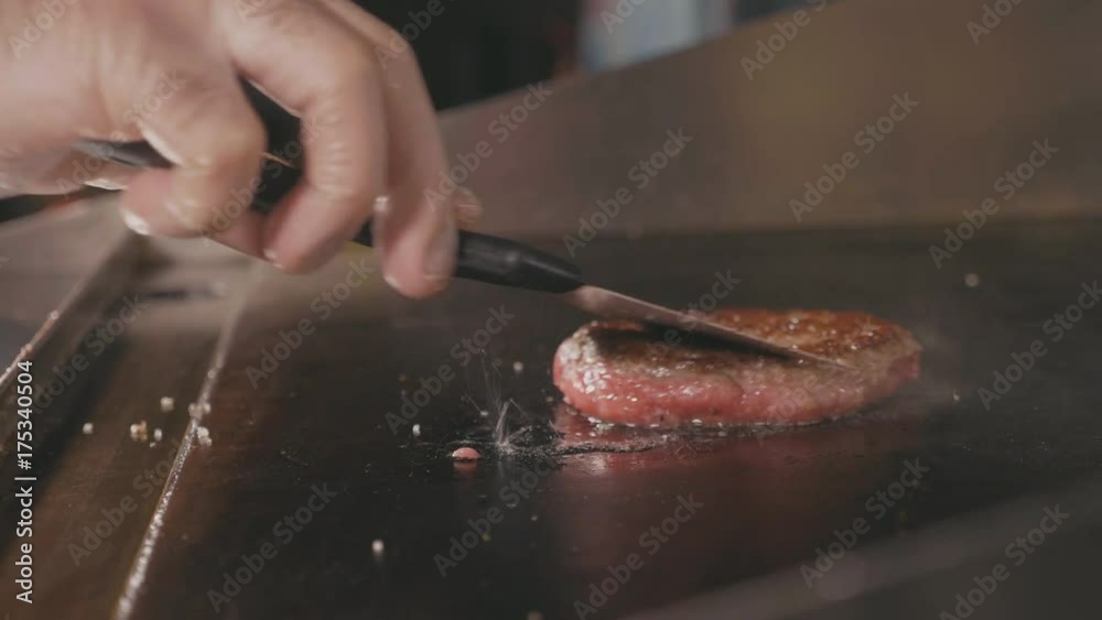 Slow motion shot of frying cutlet for burger on electric commercial grill. Slow motion shot of frying cutlet for burger on electric commercial grill.