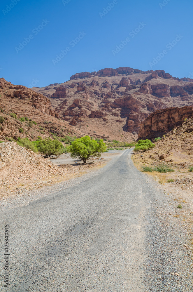 Beautiful deserted mountain landscape with road leading to horizon, Morocco, North Africa Beautiful deserted mountain landscape with road leading to horizon, Morocco, North Africa