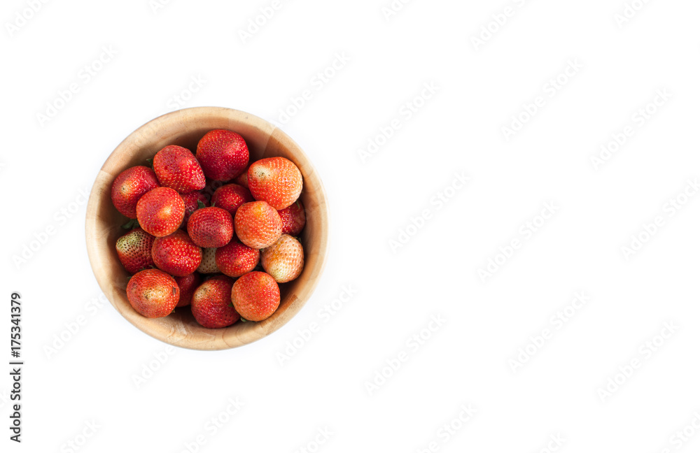 Strawberries in a wooden bowl on white background Strawberries in a wooden bowl on white background