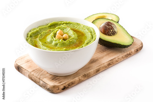 Avocado hummus in bowl isolated on white background