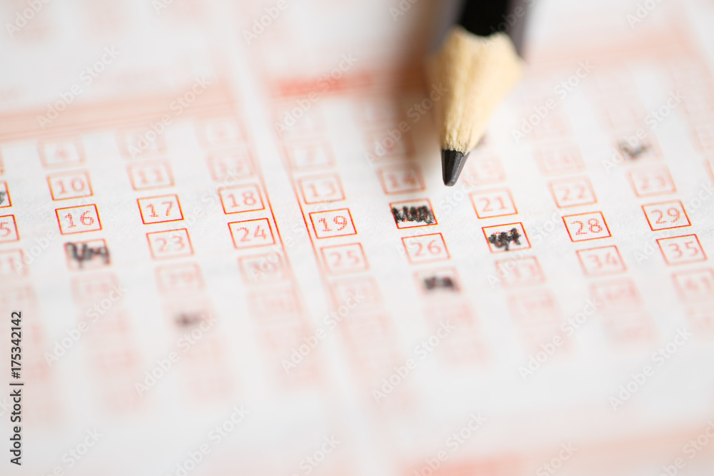Photo above of lottery ticket with pencil Photo above of lottery ticket with pencil