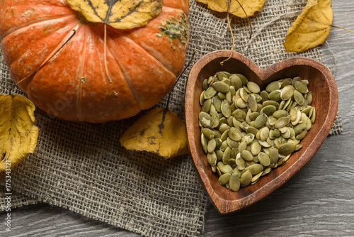 pumpkin seeds in a wooden bowl