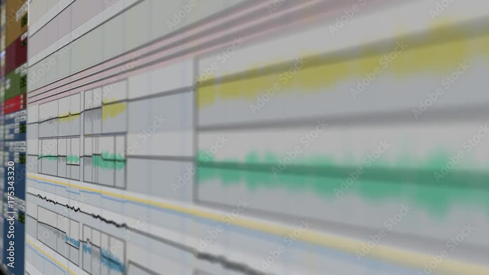Playback screen of professional pro audio digital audio workstation displaying a view at a song created in a studio with sound design and engineering elements, recording clips and waveforms