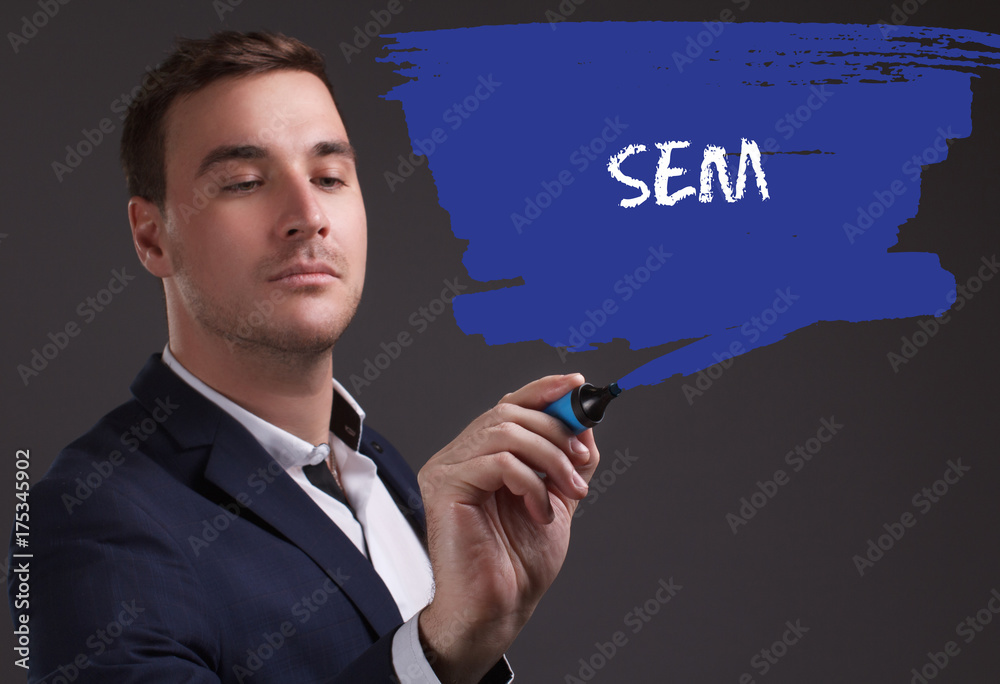 The concept of business, technology, the Internet and the network. Young businessman showing inscription: SEM The concept of business, technology, the Internet and the network. Young businessman showing inscription: SEM