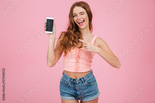 Portrait of a happy joyful girl in summer clothes