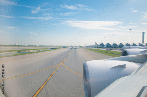 Airplane on runway prepare for take off from window view.