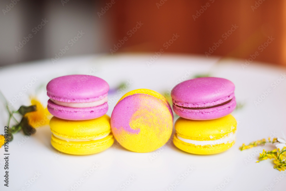 Symbol heart of flowers and macaroons on the light background. Top view. Text I love you Symbol heart of flowers and macaroons on the light background. Top view. Text I love you