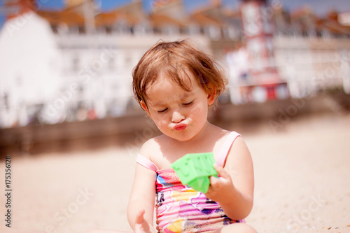 Girl and sunny day near sea