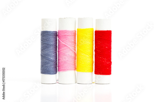 colorful spool of thread for sewing on white background