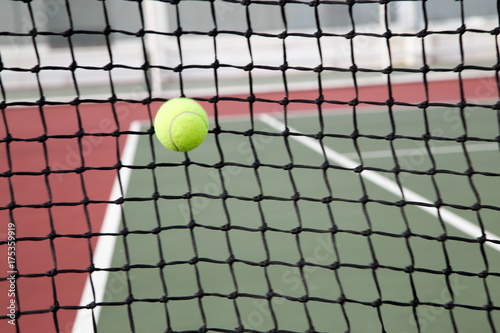 Tennis ball at net