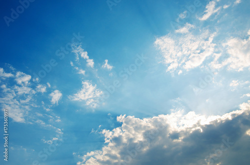 Blue sky with clouds and sun light.
