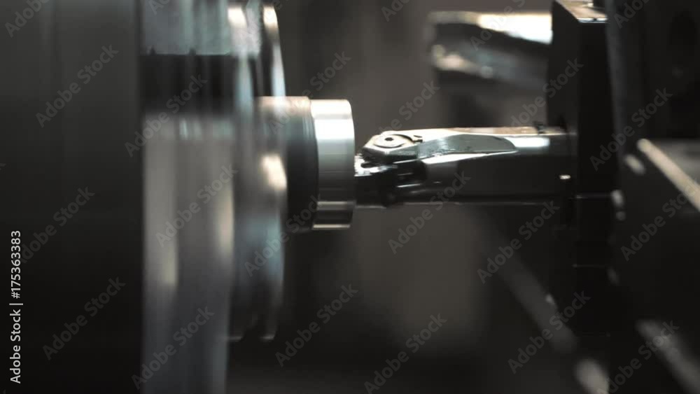 the CNC machine making the part from metal the CNC machine making the part from metal
