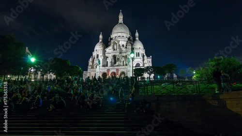 Frontal view of Sacre coeur Sacred Heart cathedral at dusk timelapse hyperlapse. Paris, France photo