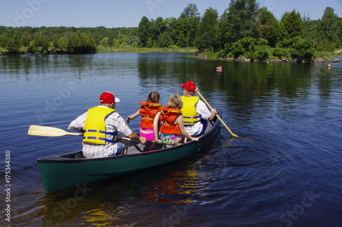Family starting canoe ride