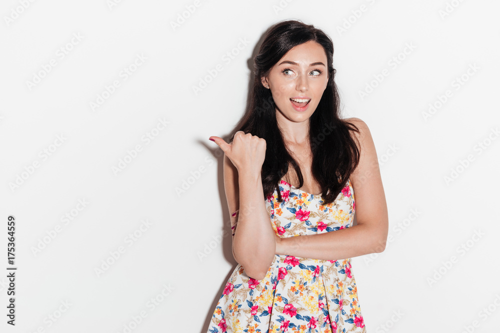 Happy surprised brunette woman posing in studio with open mouth Happy surprised brunette woman posing in studio with open mouth