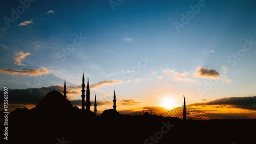 Timelapse view of Istanbul cityscape with famous Suleymaniye mosque at sunset photo