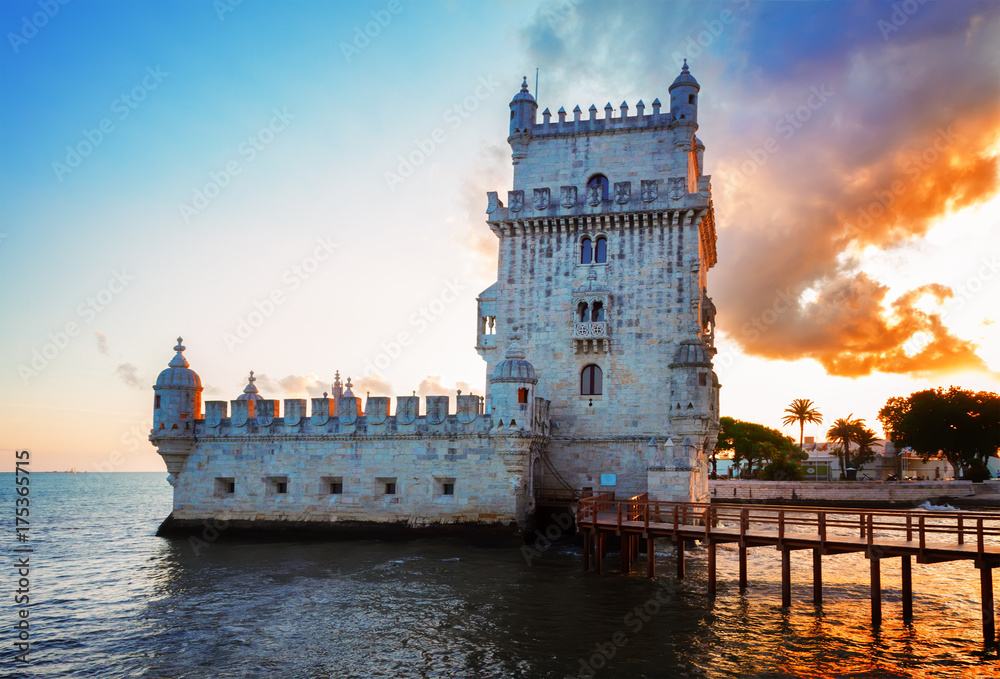 Torre of Belem at hign tide in sunset light, famouse landmark of Lisbon, Portugal, retro toned