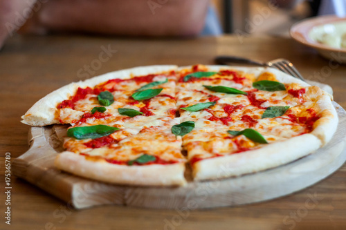 italian pizza at wooden table
