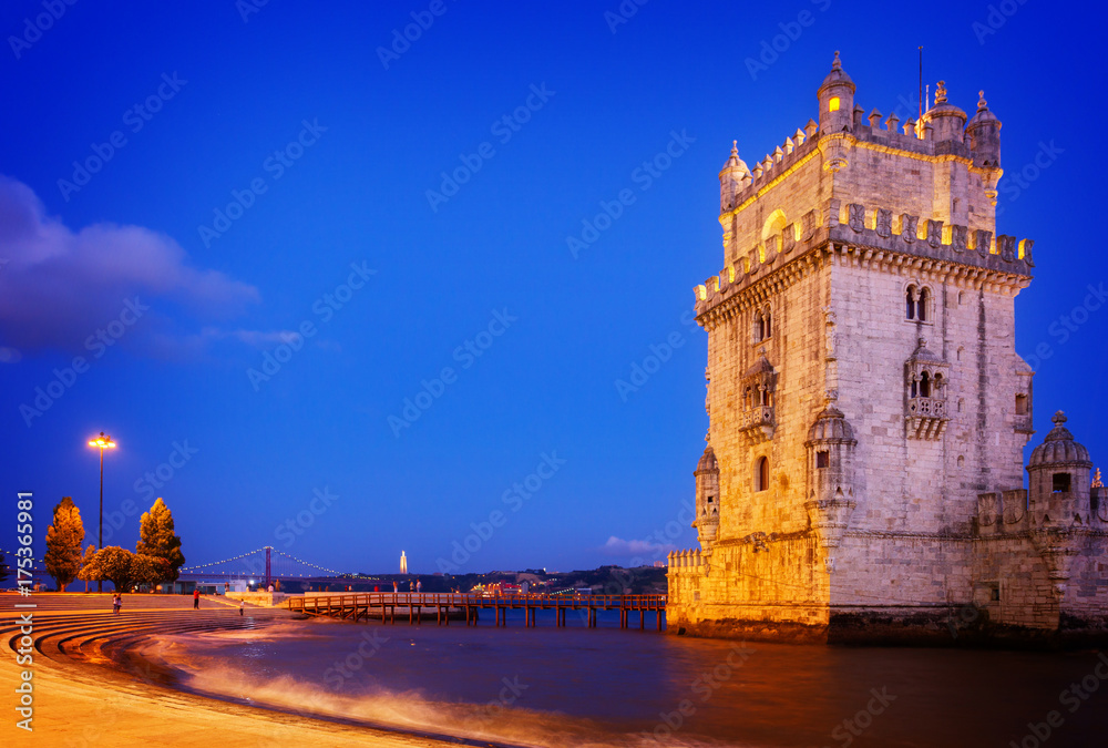 Torre of Belem at blue night, famouse landmark of Lisbon, Portugal, retro toned