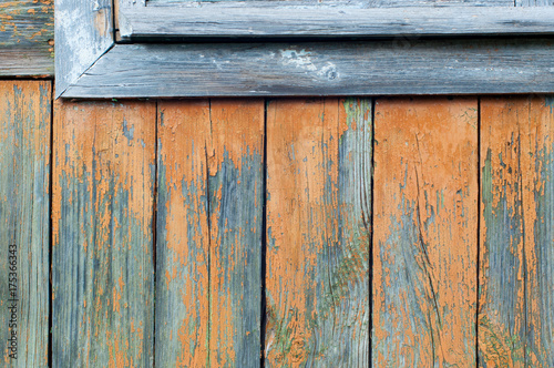Aged orange painted vertical wooden planks