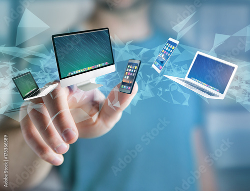 Computer and devices displayed on a futuristic interface - Multimedia and technology concept