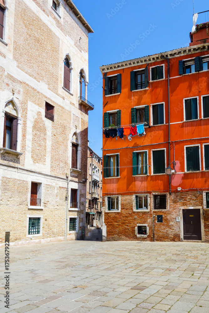 Fototapeta premium Traditional street view of old buildings in Venice, ITALY