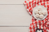 Sweet background. Meringues and sugar on white and red cloth on 