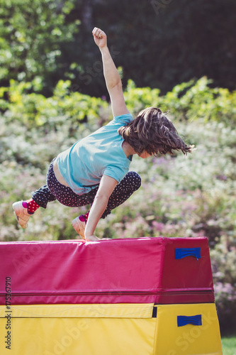 Girl Child Practicing Parkour Gymnastics Outside