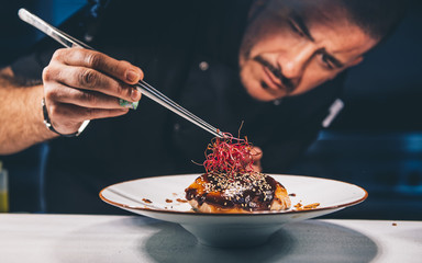 Chef watches her food