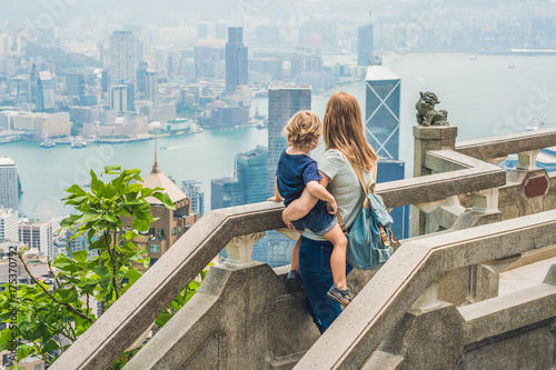 Photography Mom and son travelers at the peak of Victoria against the backdrop of Hong Kong