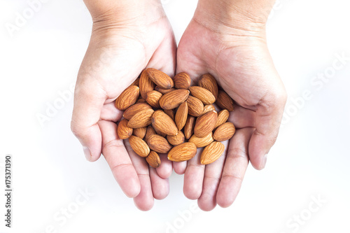 Almond seeds in hand woman
