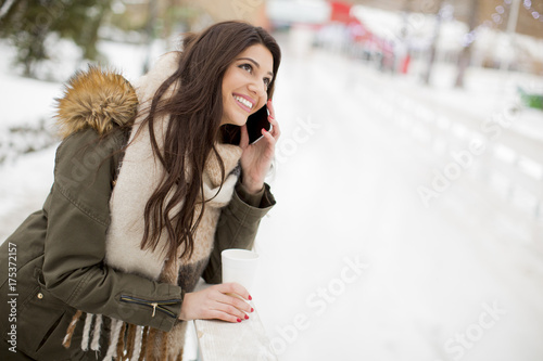 Young woman using phone in ...