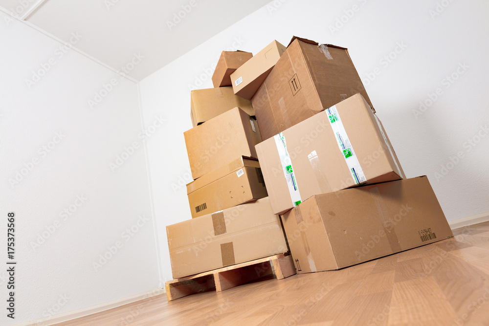 Moving in new apartment. Empty room with boxes Moving in new apartment. Empty room with boxes