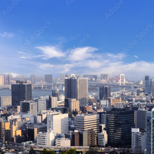 Cityscapes of Tokyo, city aerial skyscraper view of office building and downtown and street of  minato in tokyo with blue sly and clouds background. Japan, Asia © lukyeee_nuttawut