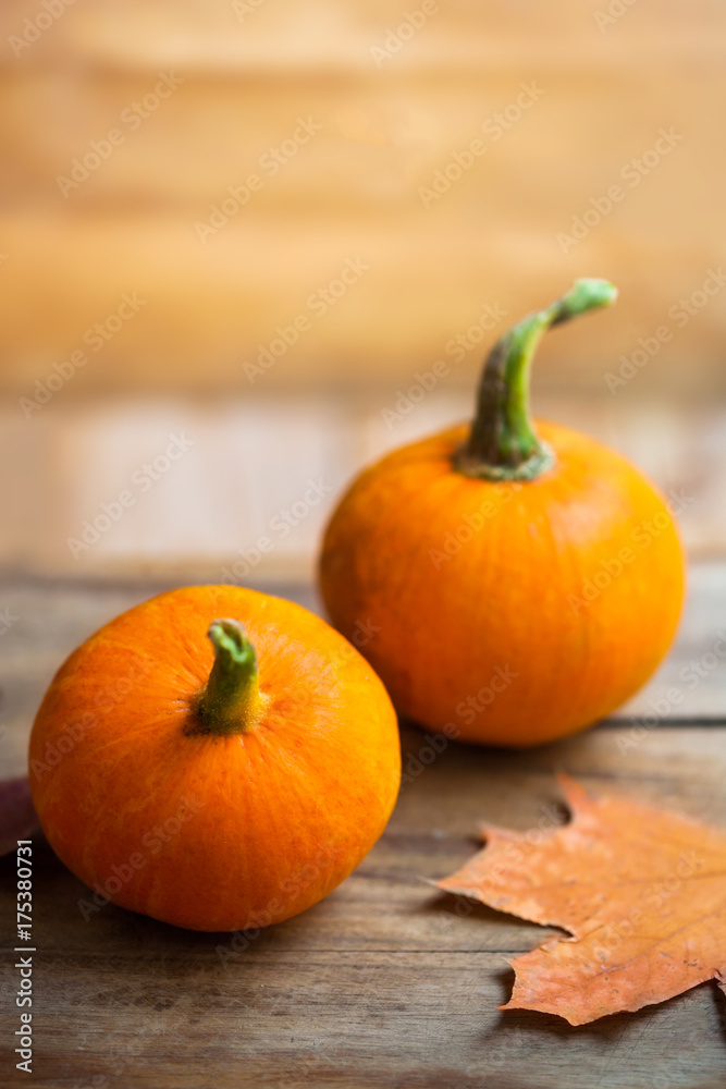 Happy Thanksgiving Day background - orange pumpkins over wooden table. Autumn nature concept.. Happy Thanksgiving Day background - orange pumpkins over wooden table. Autumn nature concept..