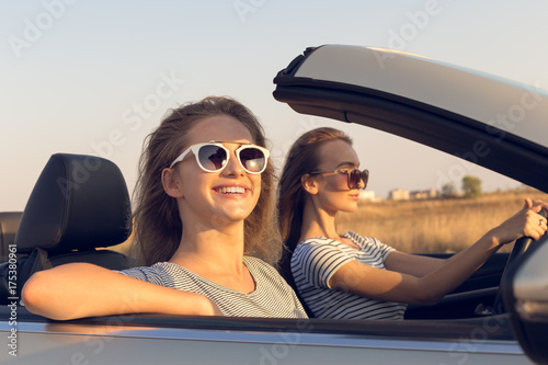 Two attractive young women in a cabriolet car © fotofabrika