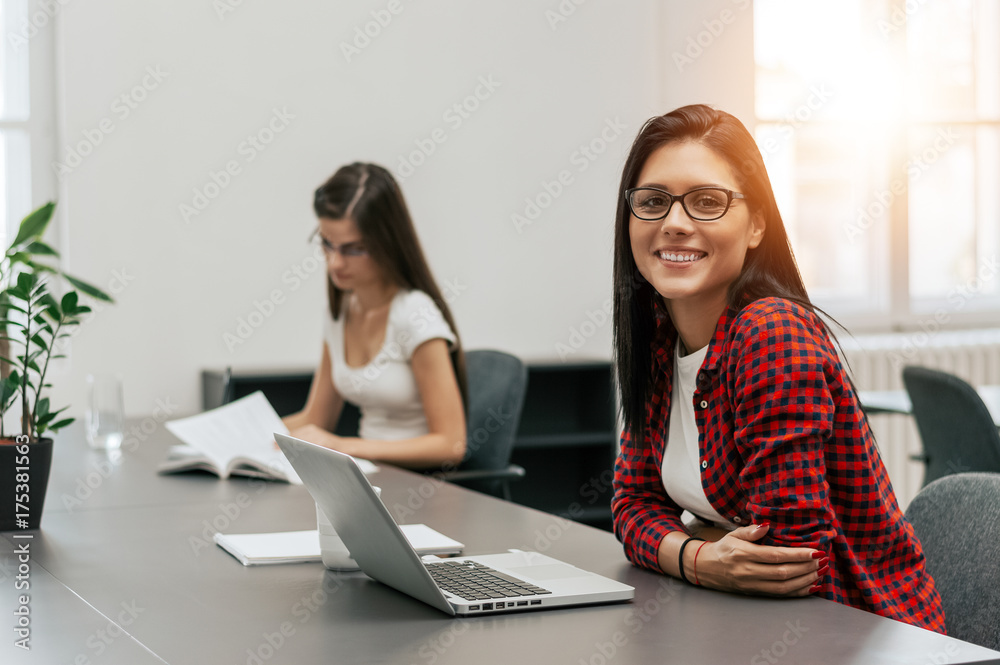 Portrait of businesswoman with glasses working in creative office Portrait of businesswoman with glasses working in creative office