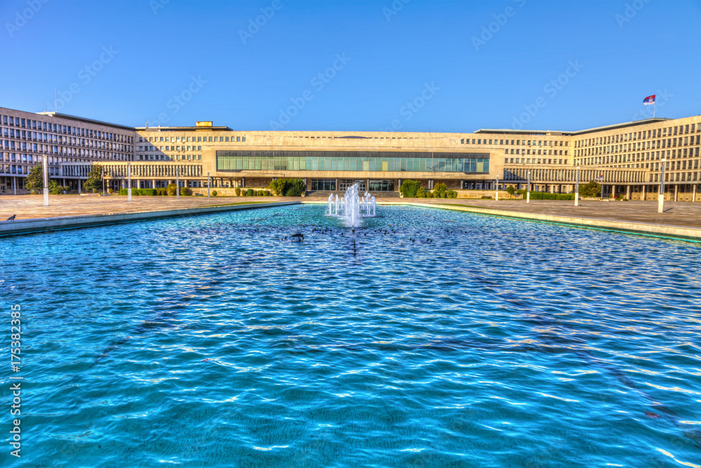 Formerly the Palace of the Federation, now called the Palace of Serbia, was built in 1959 in New Belgrade and a large fountain in front of the palace, HDR image.