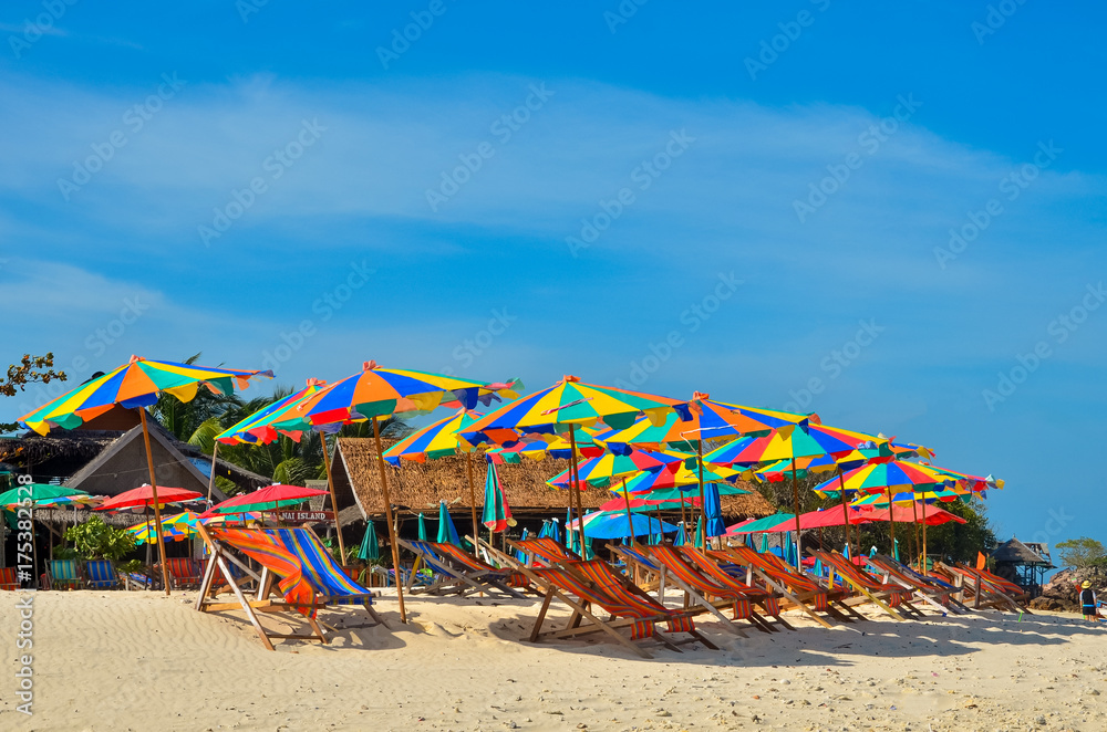 Sea,Island,umbrella,Thailand, Khai Island Phuket, Sun beds and sun umbrellas on a tropical beach Sea,Island,umbrella,Thailand, Khai Island Phuket, Sun beds and sun umbrellas on a tropical beach