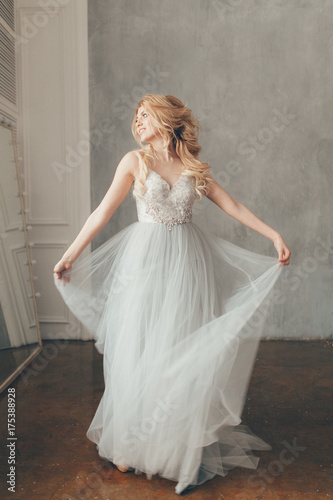wedding in European style, beautiful couple in the Studio with a small dog