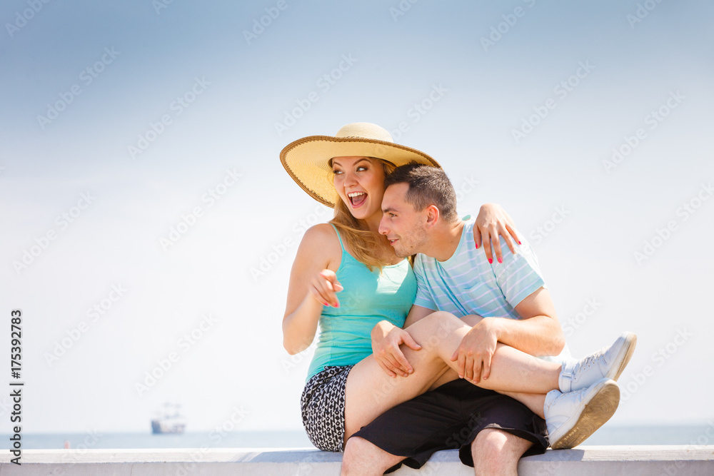 Man and woman sitting together outside