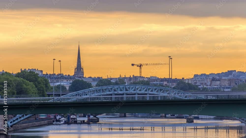 Railway bridge Pont Rouelle crossing island Ile des Cygnes timelapse at morning after sunrise in Paris