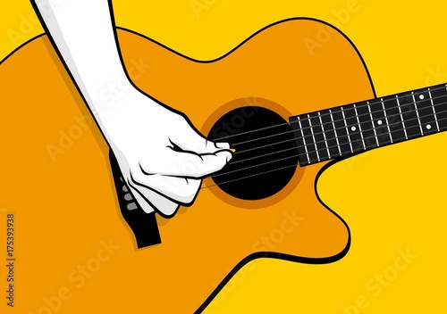 Hand playing acoustic guitar